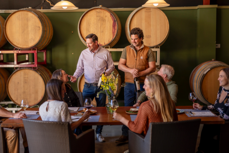 Owner-Winemakers Palmer Emmitt and Michael Scorsone entertain guests for a wine tasting in their cellar